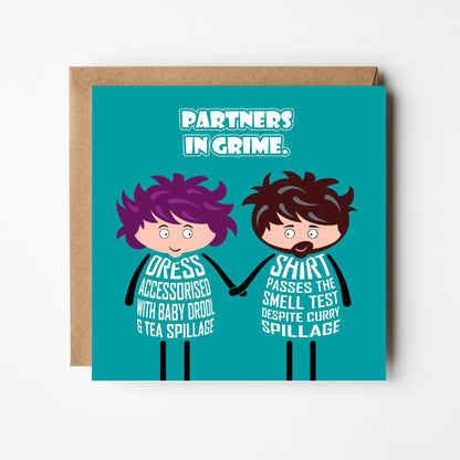 Card titled "Partners in Grime" in white text on teal background. While holding hands lovingly, a cartoon lady's body is formed from white text stating "Dress accessorised with baby drool and tea spillage" The man's body states "Shirt passes the smell test despite curry spillage"  The card is 150mm square and supplied with a recyclable eco-Kraft envelope.