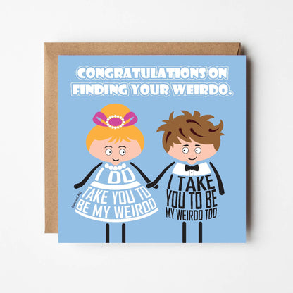 Card titled Congratulations on Finding Your Weirdo in white text on blue background.  A cartoon bride and groom hold hands.  The bride says I do take you to be my weirdo.  The groom says I take you to be my weirdo too. Card is 150mm square with eco-Kraft envelope.    