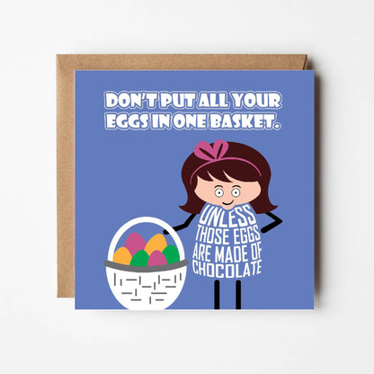 Card titled Don’t Put All Your Eggs in One Basket in white text on blue background. Cartoon lady stands next to basket full of eggs.  She says “Unless those eggs are made of chocolate”