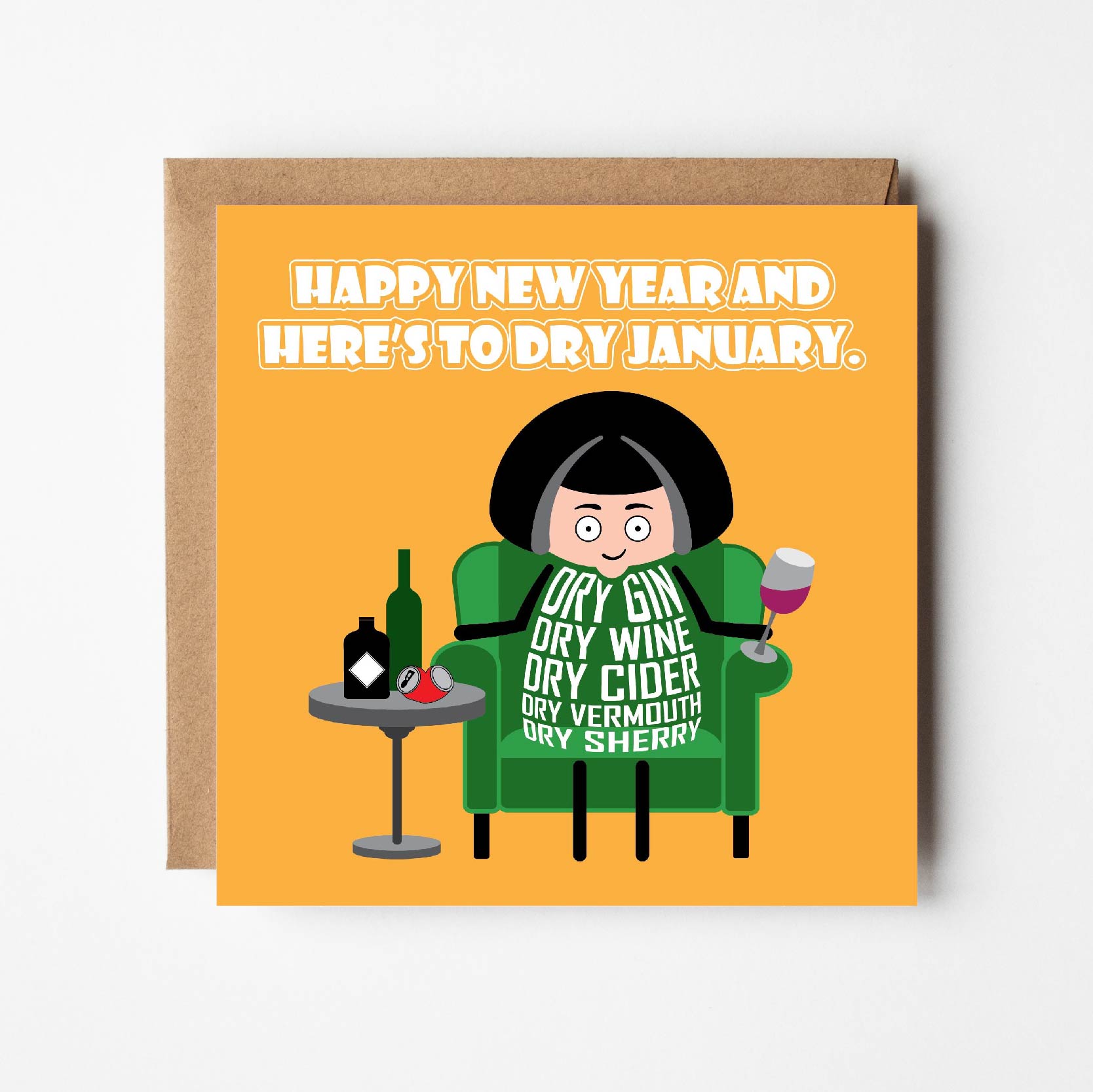 Card titled Happy New Year and Here’s to Dry January in white text on a yellow background.  A cartoon lady sits in an armchair holding a drink with many bottles on a side table.  The lady’s body is made of text listing: Dry Gin, Dry Wine, Dry Cider, Dry Vermouth, Dry Sherry. Supplied with a brown, recycled Kraft envelope.  